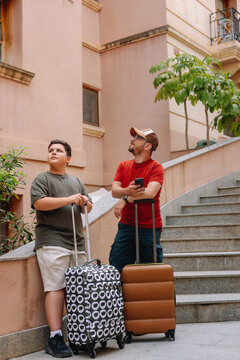 Father and son on arriving at the accommodation 