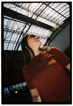 Low angle portrait of woman wearing sunglasses
