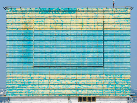Weathered Billboard Facade on Urban Skyscraper