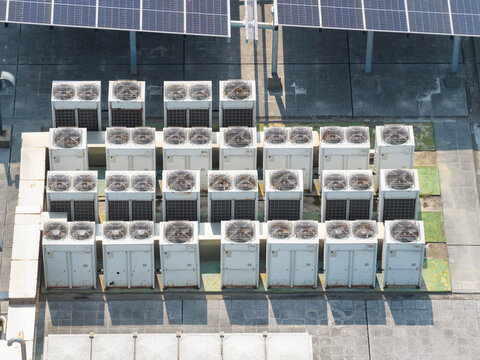 Industrial rooftop HVAC units with solar panels