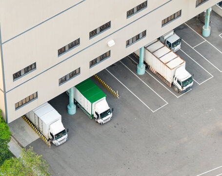 Aerial View of Logistics Warehouse Loading Dock with Trucks