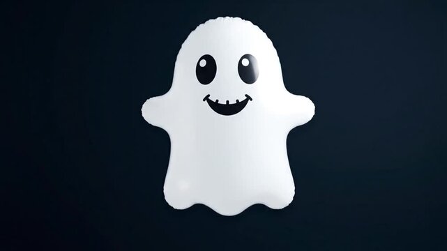 A white ghost balloon floats against a dark blue background
