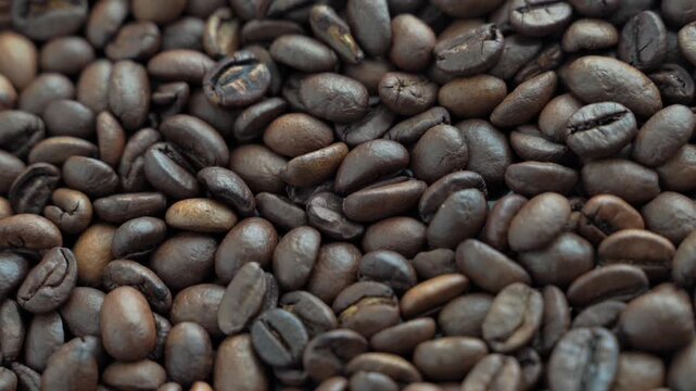  Full-screen image of roasted coffee beans rotating slowly.