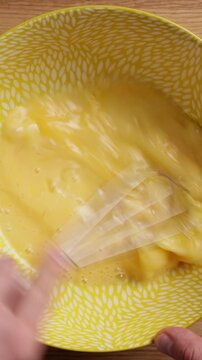 Whisking Eggs In Bowl Close Up Top View Vertical