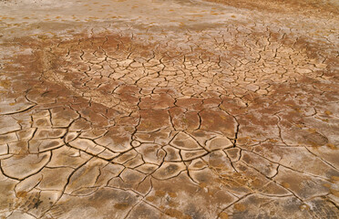 Texture of a mixture of sand, earth, clay, and snow on Lake Elton © larisa_stock
