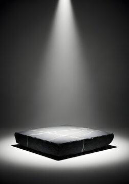 Empty black marble pedestal on a dark background with spotlight product display