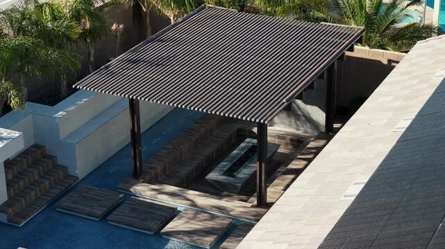 Modern louvered pergola roof overhead view on luxury residential house 4K