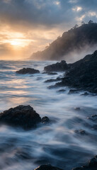 Fototapeta premium Ocean waves crashing against rocky shoreline during a golden sunset hour with shoreline landscape seascape atmosphere peaceful tranquil outdoors wilderness splashing maritime