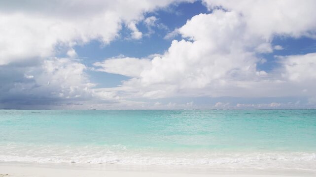 Beach background - Caribbean beach with turquoise water and white sand beach and blue sky.