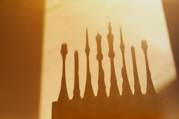 Dramatic silhouettes and long shadows of chess pieces on a warm background, strategic hidden influence concept. © Александр Ланевский
