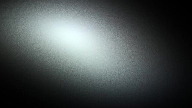 Soft silver light cascading over a textured matte surface