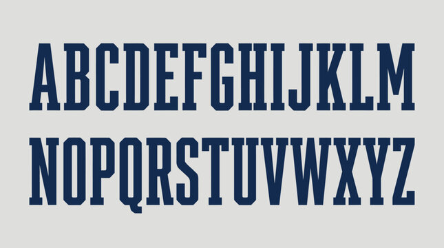 Bold blue condensed block alphabet on grey background.