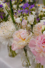 Soft floral arrangements with pink peonies and wildflowers. © sav_an_dreas