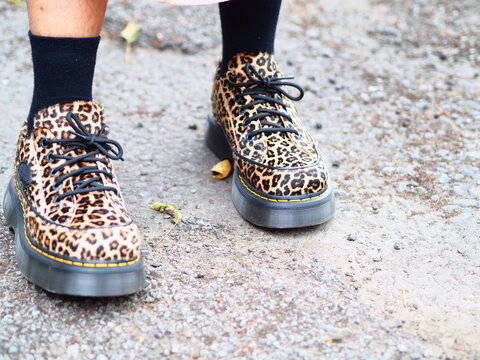 leopard print doc marten shoes work on feet, dr Martens foot wear fashion 
