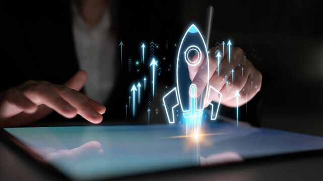 Businessperson Using Tablet to Illustrate Digital Rocket Launch Concept with Fancy Graphics and Arrows for Growth and Innovation Strategy Sigmoid