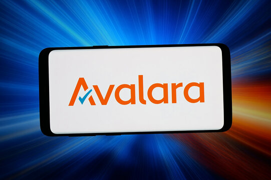 Stuttgart, Germany - 06-12-2026: In this photo illustration, the logo of tax and compliance software company Avalara is displayed on a smartphone in front of abstract background on computer screen.