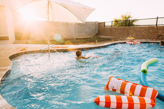 Boy swimming in pool