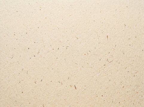 Beige paper texture background. Smooth surface of recycled cardboard with natural flecks. Vintage craft material for letter writing, document backdrop and creative graphic design