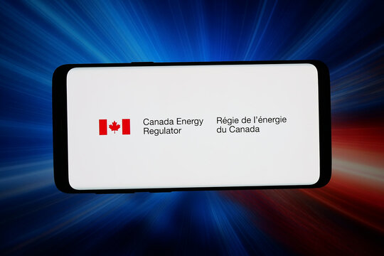 Stuttgart, Germany - 06-15-2026: In this photo illustration, the logo of agency Canada Energy Regulator (CER) is displayed on a smartphone in front of abstract background on computer screen.