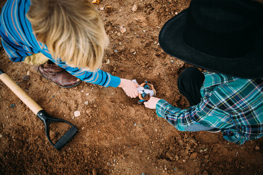 Little Boys Playing Together in the Dirt