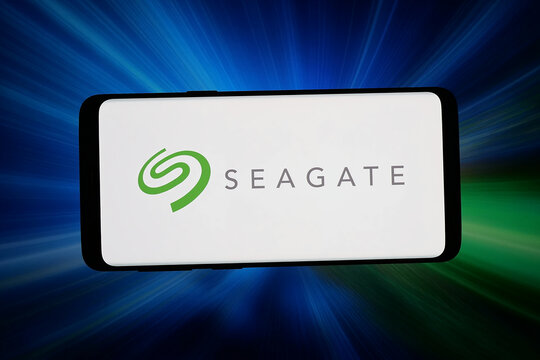 Stuttgart, Germany - 06-15-2026: In this photo illustration, the logo of company Seagate Technology Holdings plc is displayed on a smartphone in front of abstract background on computer screen.