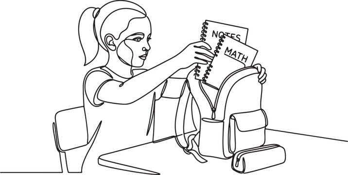 girl putting books in backpack at school desk
