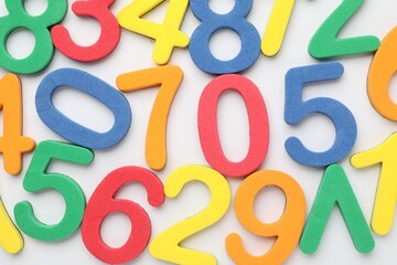 Fototapeta premium Different colorful numbers on white background, flat lay