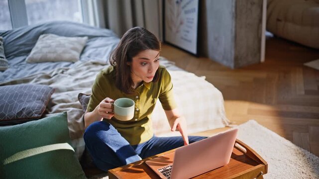 Emotional online woman talking laptop webcam chilling home floor closeup. 