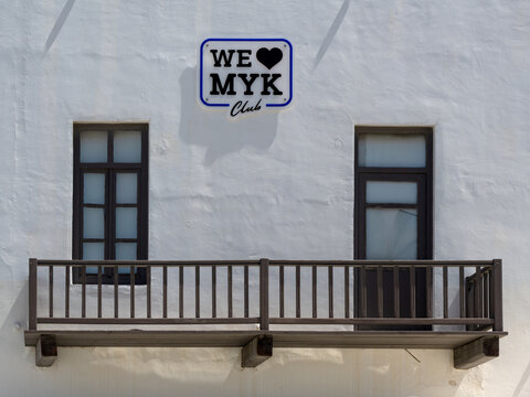 MYKONOS, GREECE - MAY 30, 2026:  We love (heart) MYK sign on building in the town