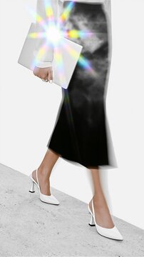 Cropped fashion image of a stylish businesswoman walking with a laptop, wearing a black midi skirt, white blouse, and white high heels against a clean minimalist background. 