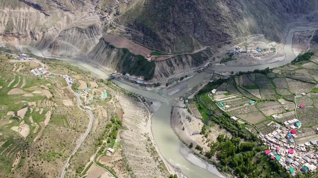 Mountain Valley Surrounded by Himalayan Peaks and river in Northern India