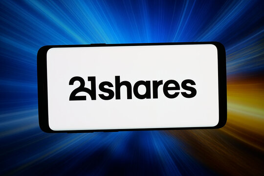 Stuttgart, Germany - 06-15-2026: In this photo illustration, the logo of crypto investment platform company 21shares is displayed on a smartphone in front of abstract background on computer screen.