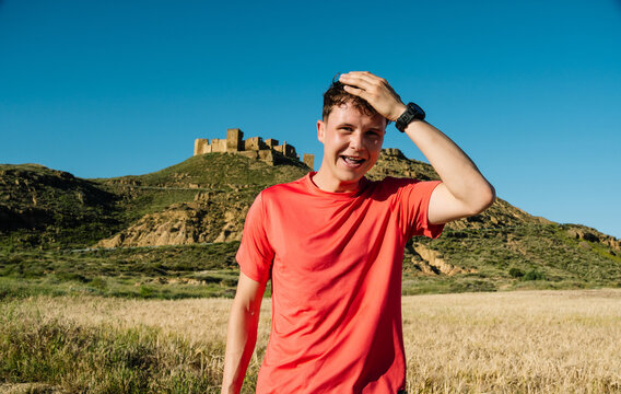 Young man smiling feeling happy after outdoor activities