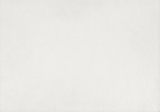 White vintage paper texture background. Antique fine art laid sheet with subtle linen fabric fiber structure. High-quality elegant clean canvas parchment mockup backdrop for wedding invitation.