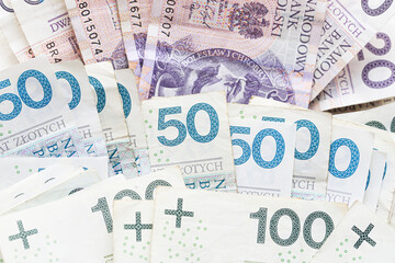 Fototapeta premium Polish banknotes arranged as financial background. Cash money concept for savings budgeting and personal finance. Currency used for payments investment and everyday expenses.