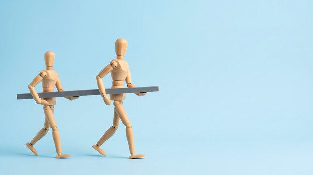 Team collaboration and shared goals alignment during mid-year performance reviews and employee evaluation KPI tracking conceptual of two wooden mannequins carrying a bar with extensive copy space