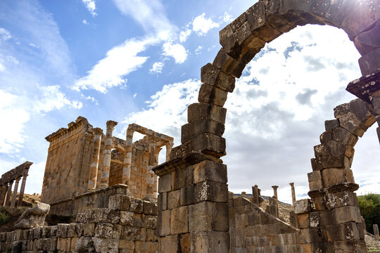 Looking through the double arches of Dj&eacute;mila toward the Arch of Caracalla