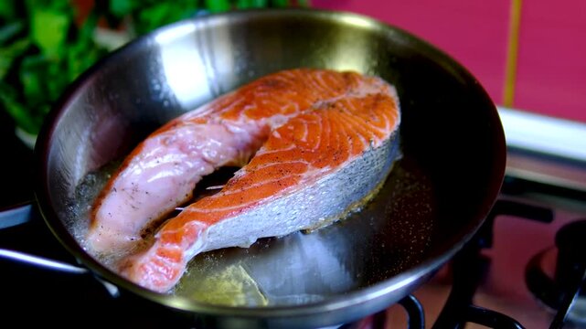 Step by step salmon recipe asparagus garlic butter cooked on stainless steel skillet in modern kitchen healthy gourmet meal preparation salmon recipe, healthy, cooking process, restaurant style meal