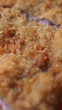 Delicious asturian cachopo, a traditional spanish dish. Breaded veal cutlets stuffed with ham and cheese are served freshly fried