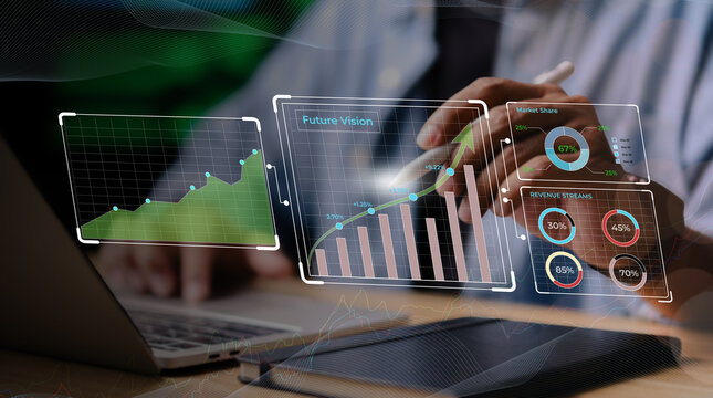 Business professional analyzing futuristic digital graphs and revenue metrics on holographic display above laptop