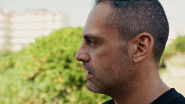 profile of a man speaking loudly