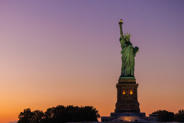 statue of liberty at sunset © Caleb