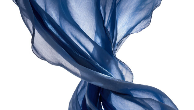 Isolated flowing rich blue silk fabric with elegant folds and sheer texture in graceful motion