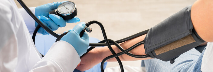 Blood pressure measurement, a procedure to monitor cardiovascular health, detect hypertension or...