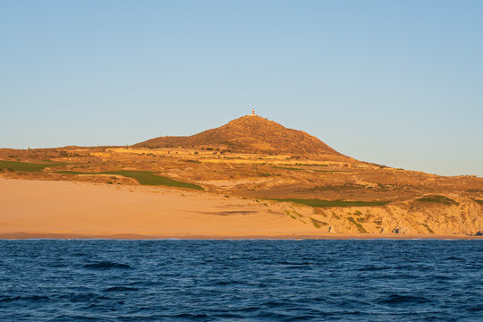 along pacific coast of baja california peninsula and cabo lighthouse atop hill 