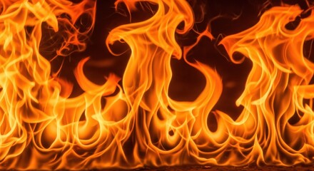 Fototapeta premium Intense orange and yellow flames dance in a fiery abstract background