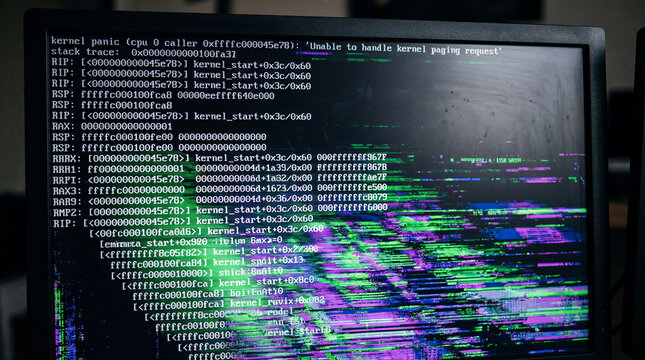 Close up of flat panel display showing a critical kernel panic error log screen layout