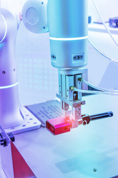 automatic arm catch for electronic assembly line. The robot for smart technology manufacturing process.   