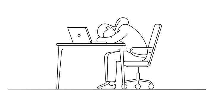 Person sleeping at a desk with a laptop computer, tired and exhausted