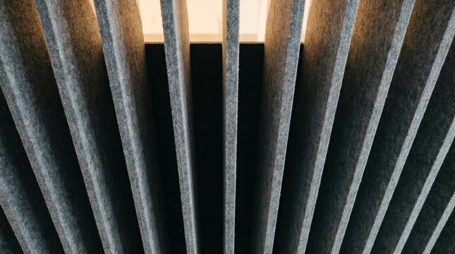 Detailed Angled View of Modern Grey Acoustic Panels Creating Textured Abstract Background